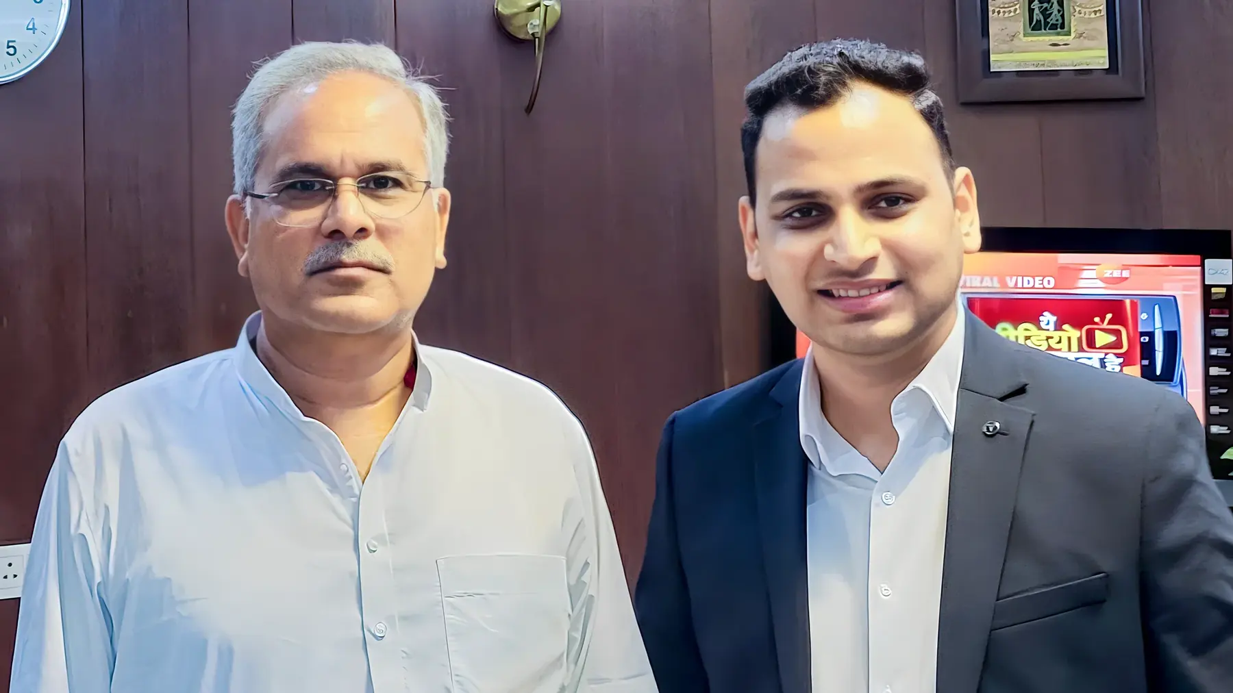 Lithvik Mukesh Sharma is photographed with Bhupesh Baghel at a business meeting.